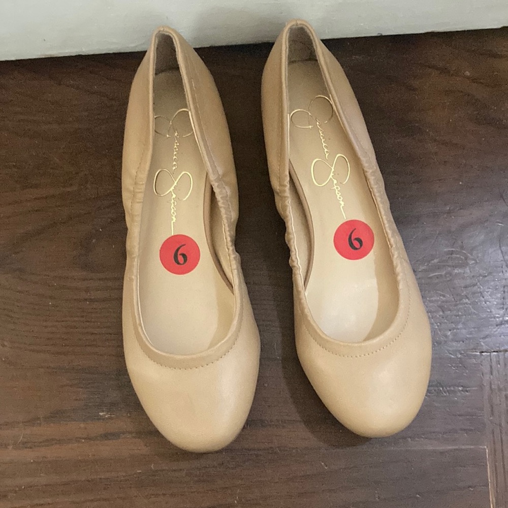 New, never worn. Nude, leather ballet flats.